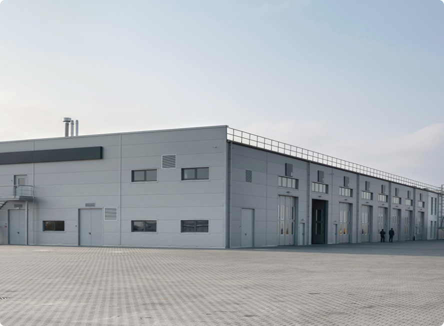 Industrial warehouse building with large doors.