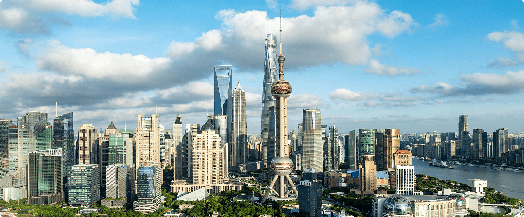 Shanghai skyline with river and skyscrapers.