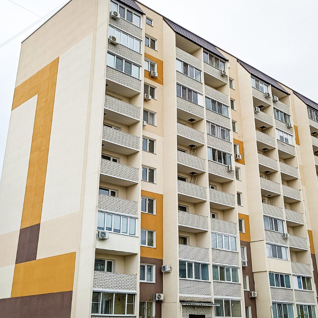 Apartment building with large number one mural.